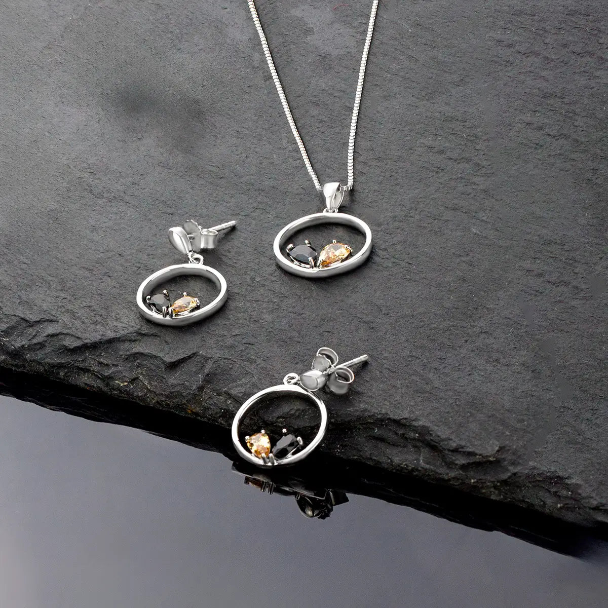 Elegant earrings: Silver with black and golden glitter of zirconias